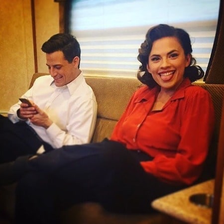 A smiling picture of Enver Gjokaj with his friend Hayley Atwell
